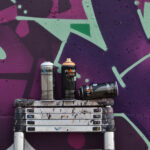 raw concrete on a sunny day with POISON GFR